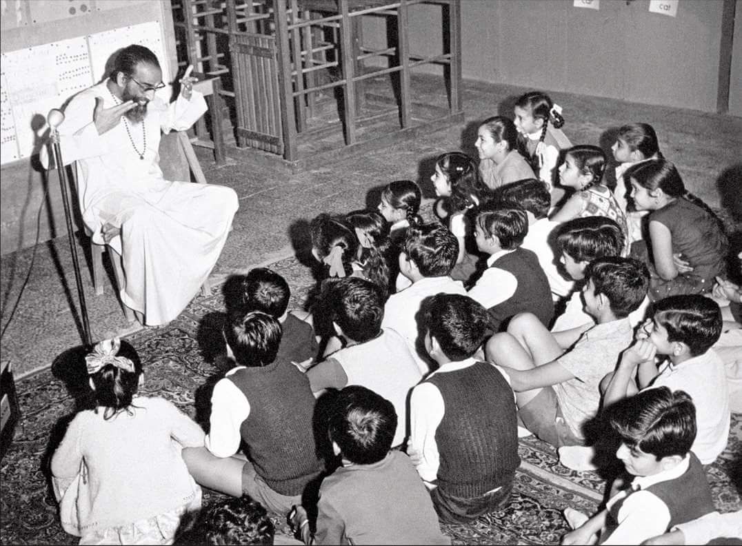 Gurudev giving samskaras or guiding principles to students